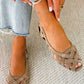Platte sandalen met open neus en gevlochten kruisbandjes